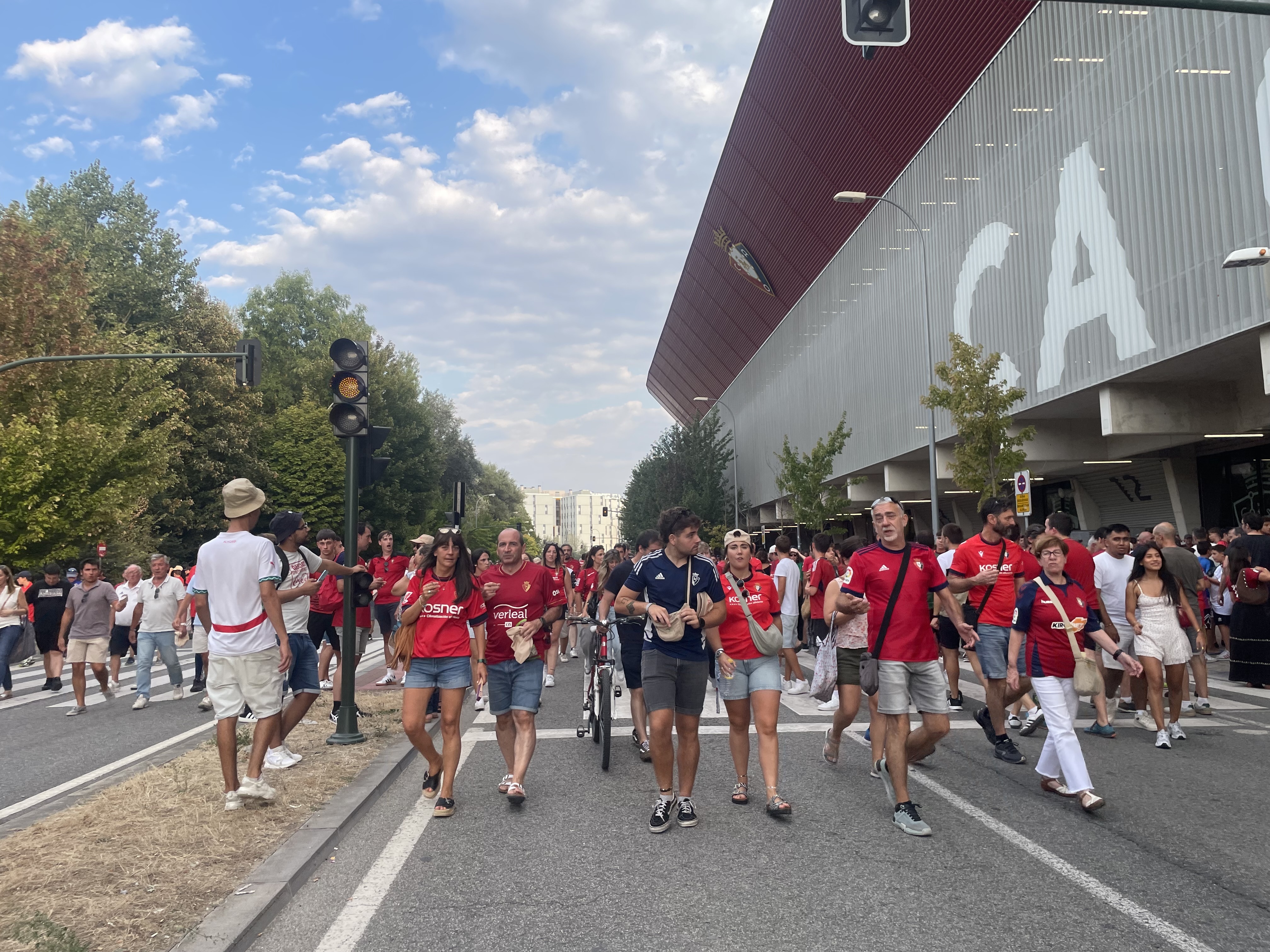 A soccer match has just ended and a river of fans pours out of Pamplona